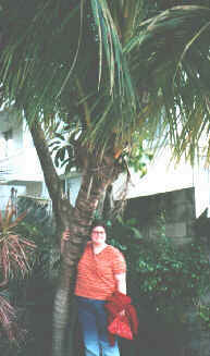 Photo of Rhonda and palm tree.
