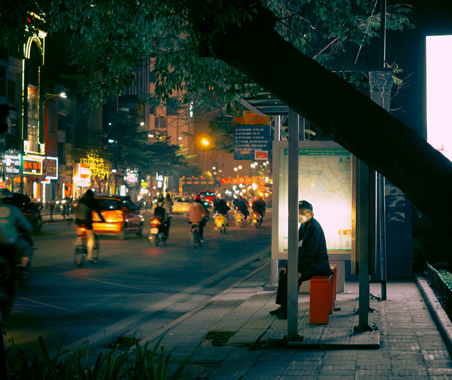 Photo by Anh Tuan: https://www.pexels.com/photo/a-man-waiting-on-bus-stop-during-nighttime-10901975/